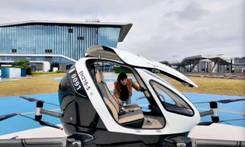 A Global Times reporter experiences the EH216?S manned eVTOL aircraft at a flight base of Guangzhou Suigang Ferry Terminal in Guangzhou Development District. Photo: Chen Zishuai/GT